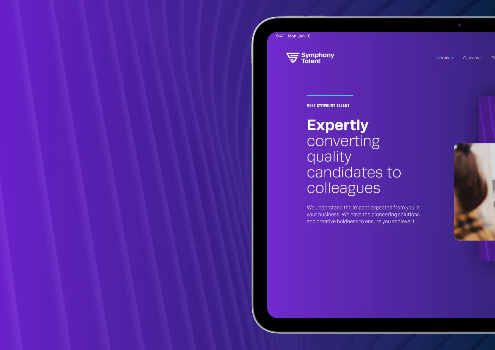 the symphony talent website shown on an ipad on a purple background