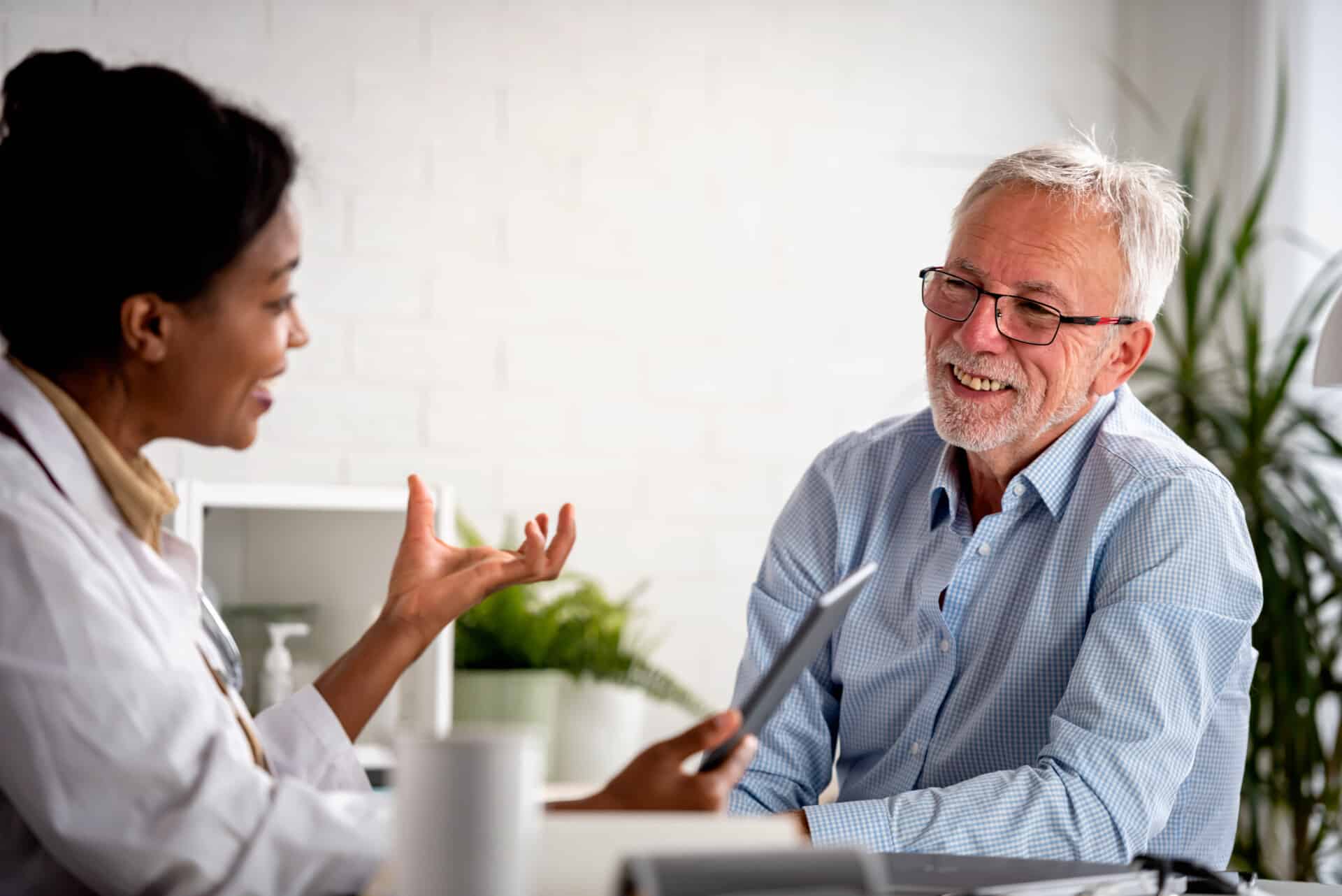 Doctor specialist consulting a patient in a doctor's office at a clinic.